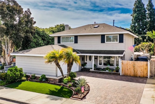 7612 Appleby, Huntington Beach, CA 92648 - traditional-style home with a gate, fence, decorative driveway, a chimney, and a shingled roof