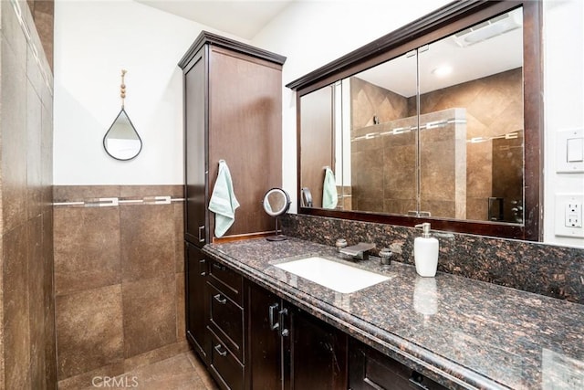 7612 Appleby, Huntington Beach, CA 92648 - bathroom with a shower stall, tile walls, and vanity