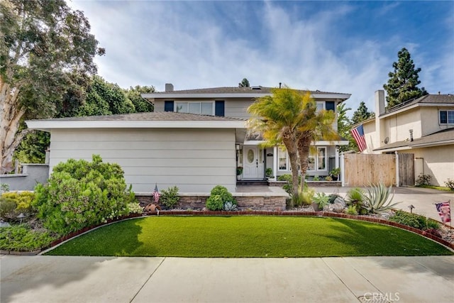 7612 Appleby, Huntington Beach, CA 92648 - view of front of property with fence, a front lawn, and concrete driveway