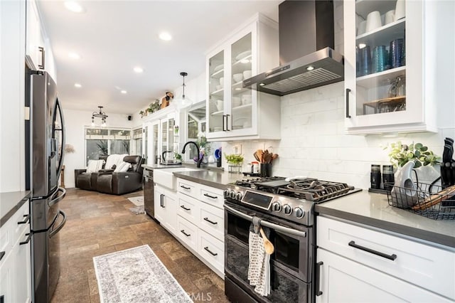 7612 Appleby, Huntington Beach, CA 92648 - kitchen with open floor plan, decorative backsplash, a sink, appliances with stainless steel finishes, and wall chimney exhaust hood
