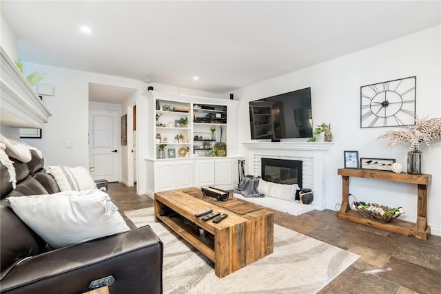 7612 Appleby, Huntington Beach, CA 92648 - living room featuring baseboards, a fireplace, stone finish floor, and recessed lighting