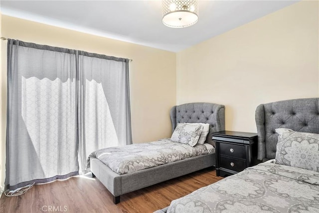bedroom featuring wood finished floors