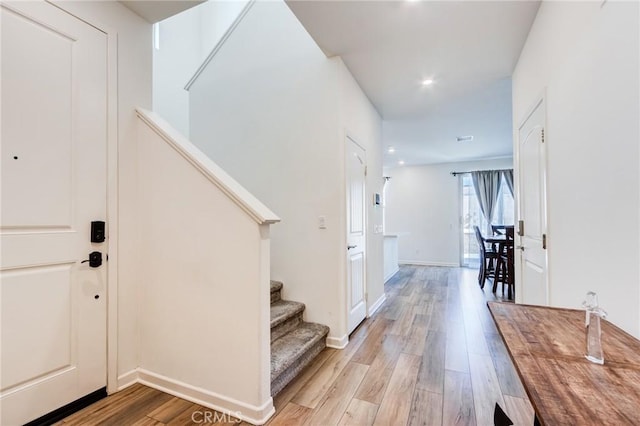 972 W Jasmine Way, Rialto, CA 92376 - foyer entrance with light wood finished floors, stairs, and recessed lighting