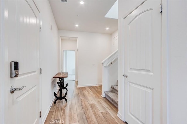 972 W Jasmine Way, Rialto, CA 92376 - hall featuring light wood-type flooring, stairway, and recessed lighting