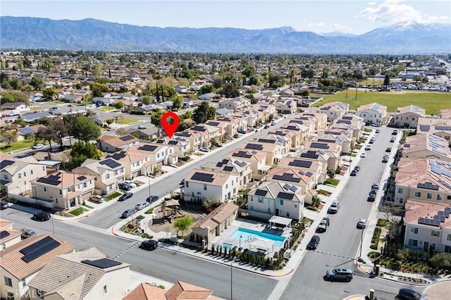 972 W Jasmine Way, Rialto, CA 92376 - aerial perspective of suburban area with a mountainous background and a pool area
