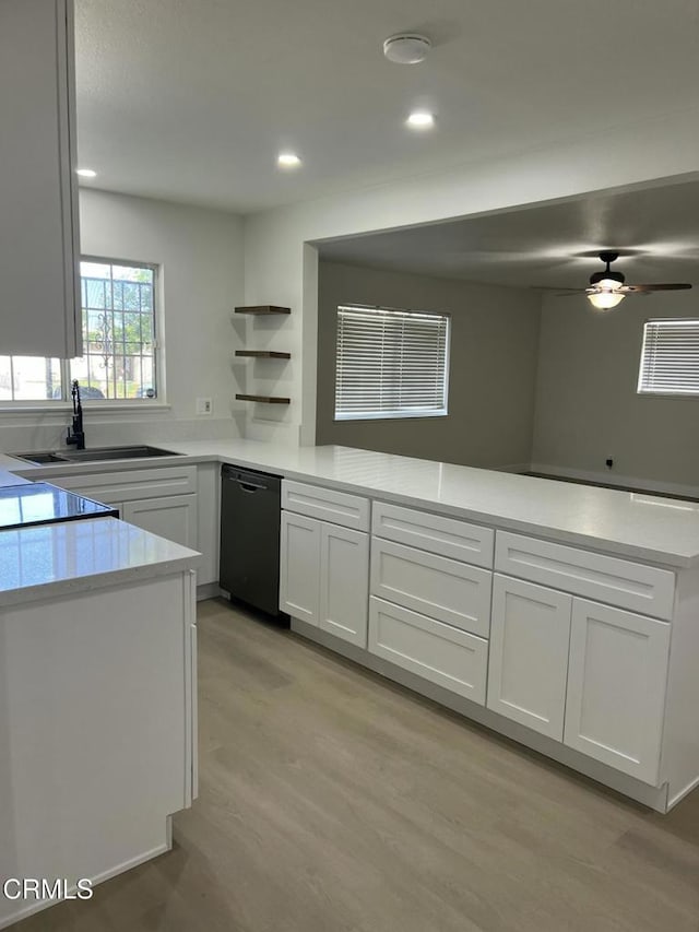 391 N 9th St, Blythe, CA 92225 - kitchen featuring open shelves, a sink, light countertops, a peninsula, and black dishwasher