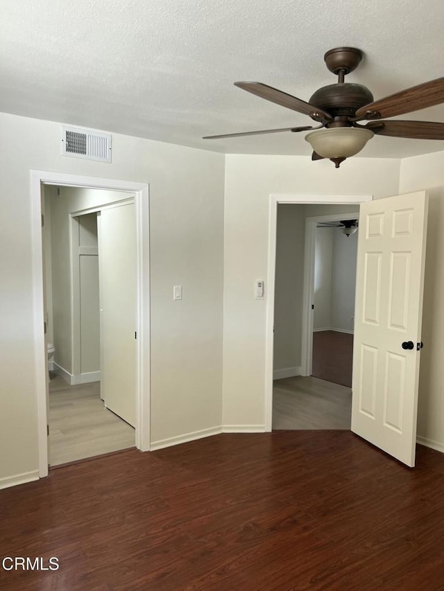 391 N 9th St, Blythe, CA 92225 - unfurnished room with wood finished floors, a textured ceiling, ceiling fan, baseboards, and visible vents