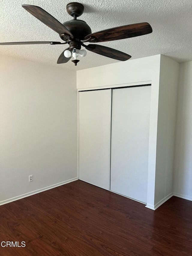 391 N 9th St, Blythe, CA 92225 - unfurnished bedroom with wood finished floors, a closet, baseboards, a ceiling fan, and a textured ceiling