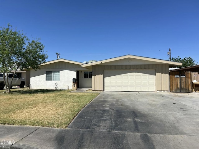 391 N 9th St, Blythe, CA 92225 - ranch-style home with concrete driveway, a front lawn, and a garage