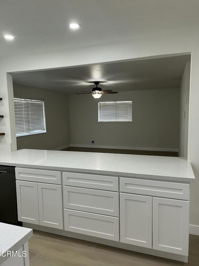 391 N 9th St, Blythe, CA 92225 - kitchen with recessed lighting, a ceiling fan, light wood-style floors, black dishwasher, and white cabinetry