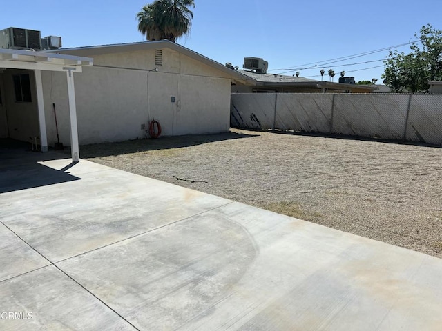 391 N 9th St, Blythe, CA 92225 - exterior space with fence, a patio area, and central AC