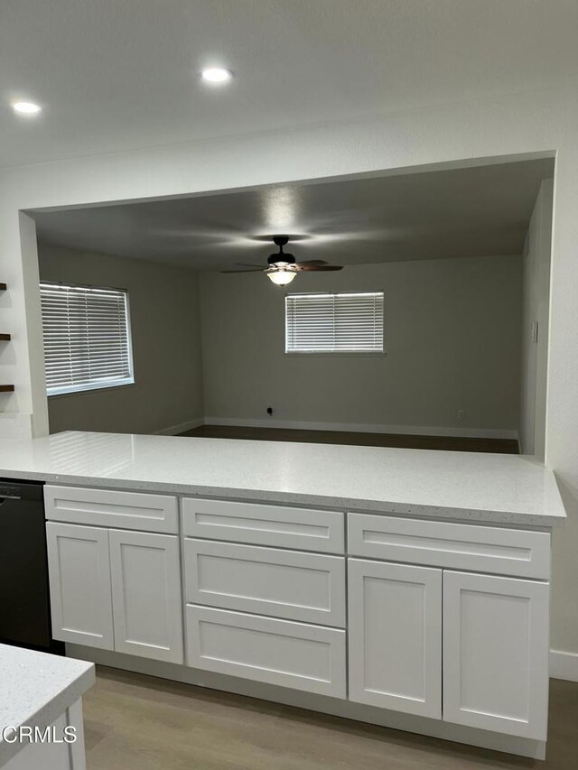 391 N 9th St, Blythe, CA 92225 - kitchen featuring black dishwasher, ceiling fan, white cabinets, light wood finished floors, and recessed lighting