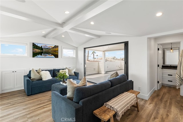 living room with lofted ceiling with beams, light wood-style flooring, and recessed lighting