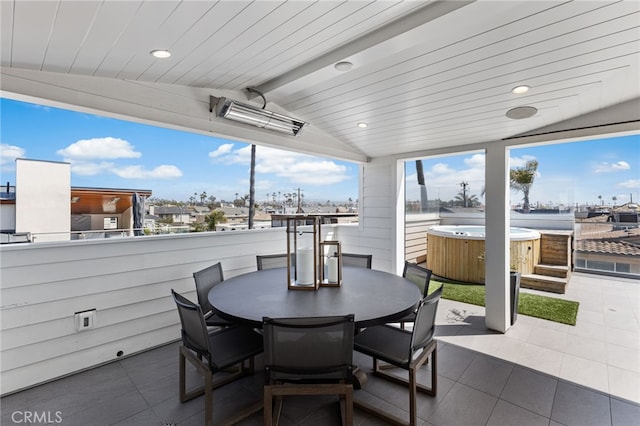 view of patio featuring a hot tub and outdoor dining space