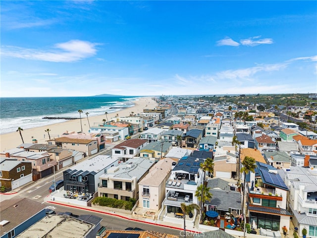 birds eye view of property featuring a residential view, a view of the beach, and a water view