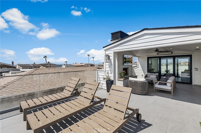 view of patio / terrace featuring a ceiling fan and outdoor lounge area