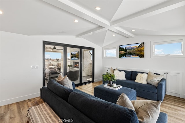 living room with lofted ceiling with beams, baseboards, light wood finished floors, and recessed lighting