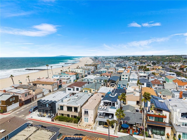 birds eye view of property featuring a beach view, a residential view, and a water view