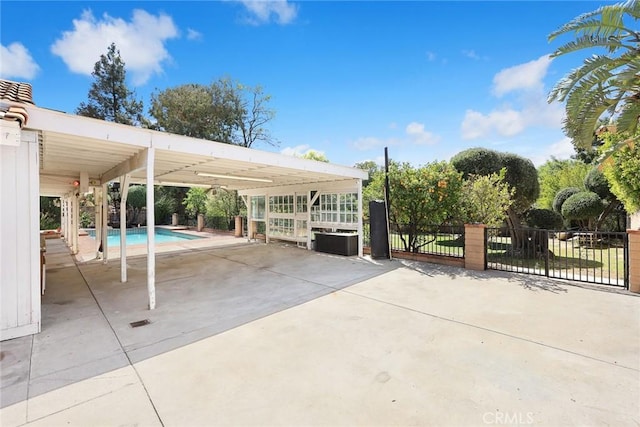 13771 De Garmo Ave, Rancho Cascades, CA 91342 - view of patio / terrace featuring a carport, concrete driveway, and fence