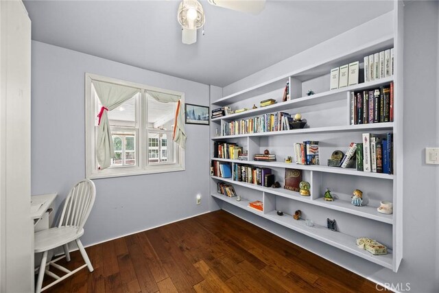 13771 De Garmo Ave, Rancho Cascades, CA 91342 - sitting room with dark wood-style flooring and ceiling fan