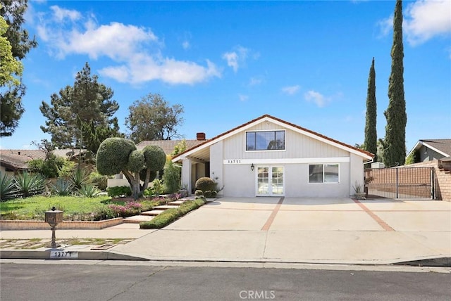 13771 De Garmo Ave, Rancho Cascades, CA 91342 - view of front facade featuring fence and driveway