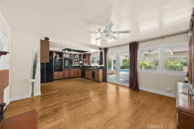 13771 De Garmo Ave, Rancho Cascades, CA 91342 - kitchen with black appliances, dark countertops, ceiling fan, and baseboards
