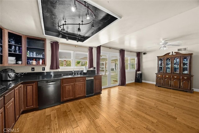 13771 De Garmo Ave, Rancho Cascades, CA 91342 - kitchen with dishwasher, dark countertops, light wood-style flooring, and healthy amount of natural light