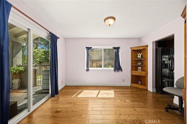 13771 De Garmo Ave, Rancho Cascades, CA 91342 - interior space featuring plenty of natural light, hardwood / wood-style floors, and baseboards