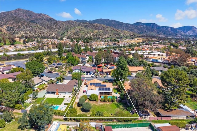 13771 De Garmo Ave, Rancho Cascades, CA 91342 - aerial view of property's location with property boundaries highlighted, a mountain backdrop, and nearby suburban area