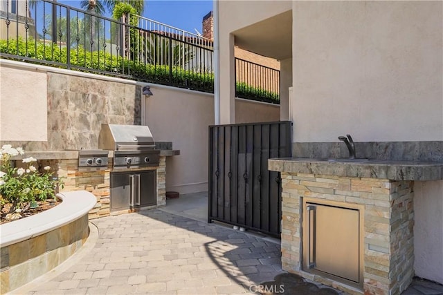 8113 Newcastle Dr, Whittier, CA 90605 - view of patio featuring a grill, fence, area for grilling, and a sink