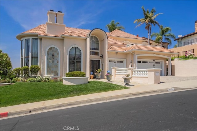 8113 Newcastle Dr, Whittier, CA 90605 - mediterranean / spanish house featuring driveway, a chimney, a tiled roof, a front yard, and a garage