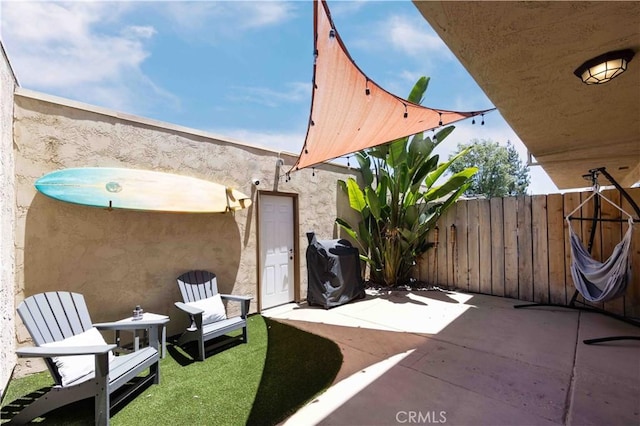 view of patio with fence