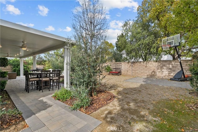 view of patio / terrace featuring outdoor dining space, ceiling fan, and a fenced backyard