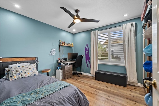 bedroom featuring ceiling fan, recessed lighting, hardwood / wood-style flooring, and baseboards