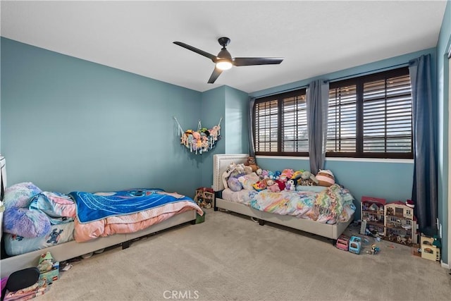 bedroom with carpet floors and a ceiling fan