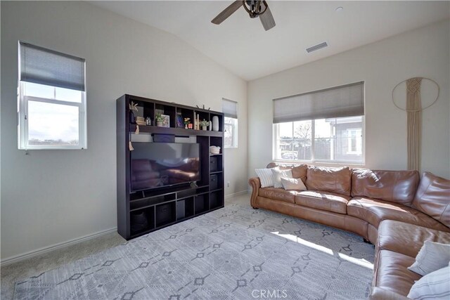 living room with a ceiling fan, visible vents, carpet floors, lofted ceiling, and baseboards