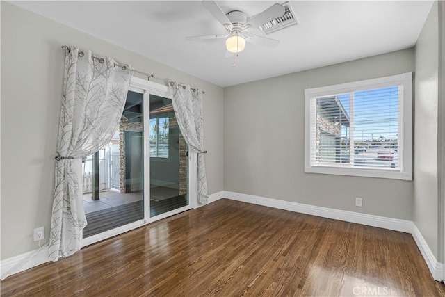 7451 Western Ave, Buena Park, CA 90620 - unfurnished room with wood finished floors, visible vents, a ceiling fan, and baseboards