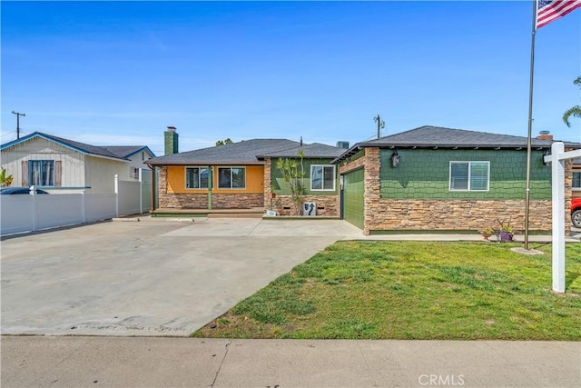 7451 Western Ave, Buena Park, CA 90620 - ranch-style house with fence, stone siding, a front yard, concrete driveway, and an attached garage