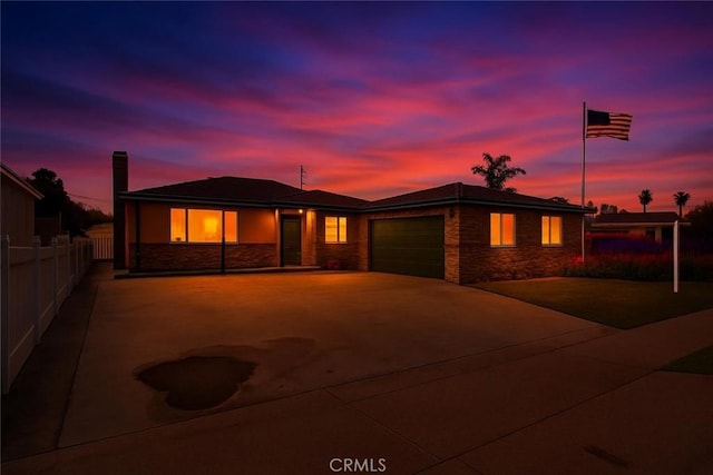 7451 Western Ave, Buena Park, CA 90620 - view of front of home featuring fence, concrete driveway, and an attached garage