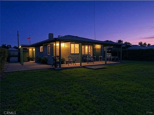 7451 Western Ave, Buena Park, CA 90620 - back of property at dusk featuring fence and a yard