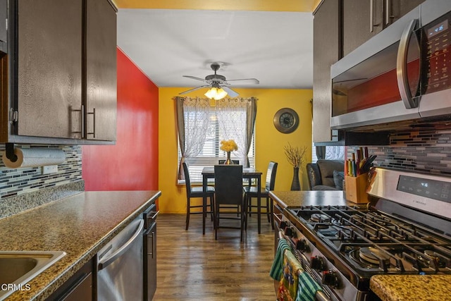 2538 Bolker Dr, Port Hueneme, CA 93041 - kitchen with appliances with stainless steel finishes, backsplash, a ceiling fan, and dark wood finished floors