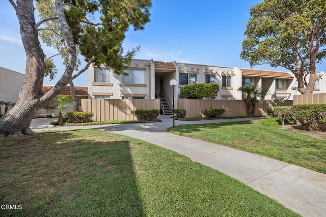 2538 Bolker Dr, Port Hueneme, CA 93041 - view of property with stucco siding and stairs