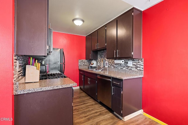 2538 Bolker Dr, Port Hueneme, CA 93041 - kitchen with dishwasher, backsplash, dark wood-style floors, and freestanding refrigerator