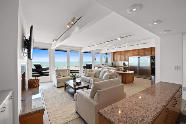 35321 Beach Rd, Dana Point, CA 92624 - living room with a wall of windows, track lighting, and light tile patterned floors