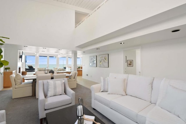 35321 Beach Rd, Dana Point, CA 92624 - carpeted living room featuring beamed ceiling and a high ceiling