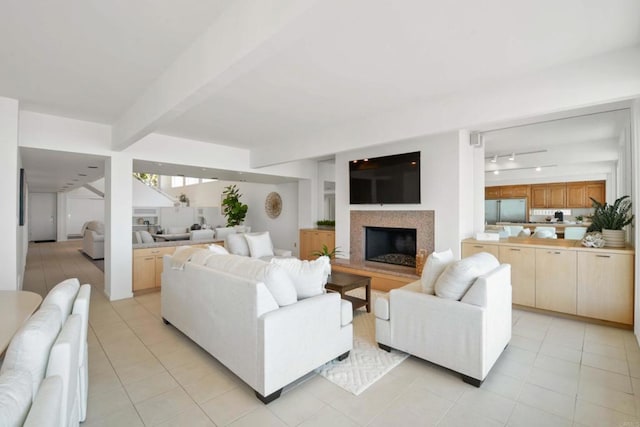 35321 Beach Rd, Dana Point, CA 92624 - living area featuring light tile patterned flooring, a fireplace with raised hearth, rail lighting, and beamed ceiling
