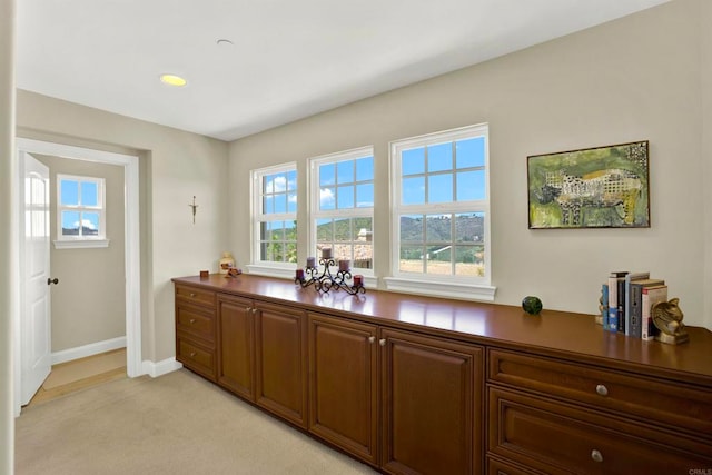 bar featuring recessed lighting, baseboards, and light colored carpet