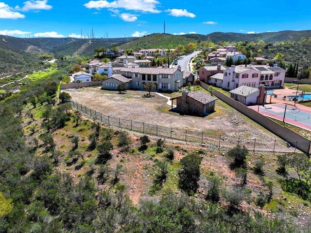 drone / aerial view with a residential view and a mountain view
