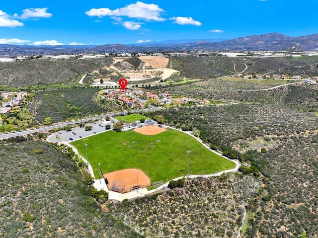 birds eye view of property featuring a mountain view