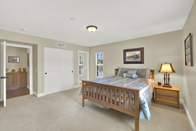 bedroom with visible vents, baseboards, and carpet floors